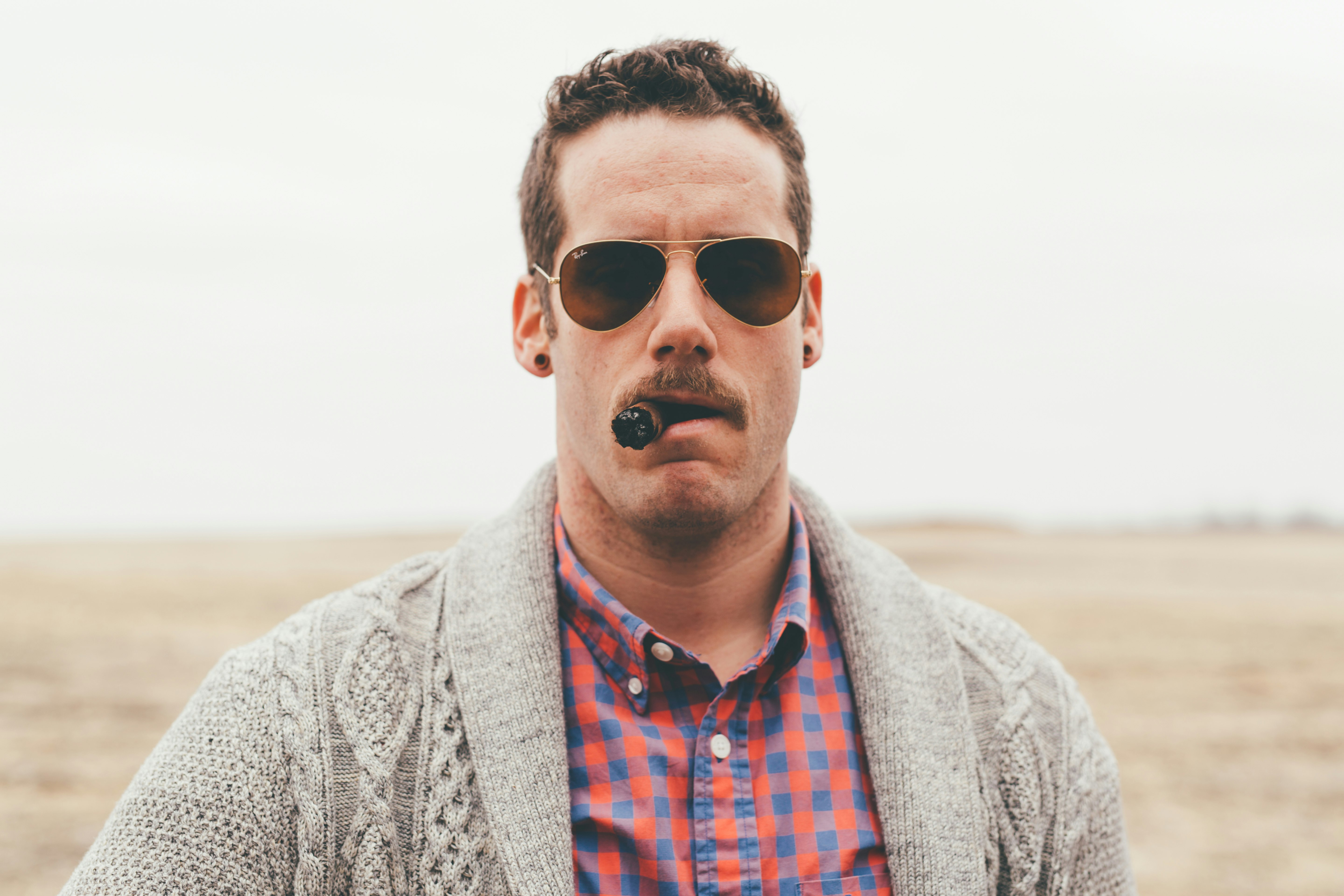 photography of man using tobacco